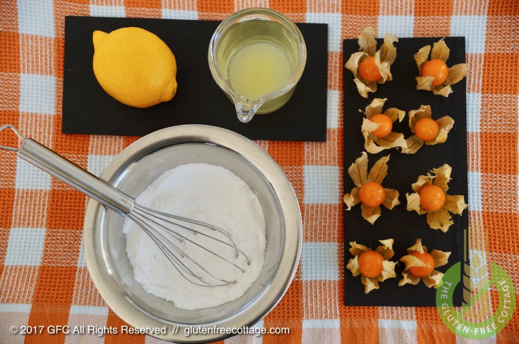 Ingredients for lemon icing glaze. Physalis for decoration (gluten-free poppy seed cake).