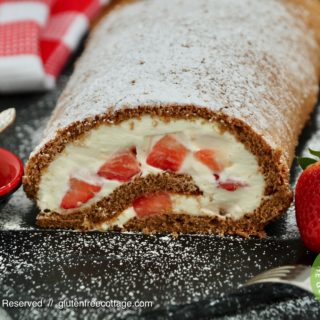 Gluten-free chocolate roll cake with strawberries.