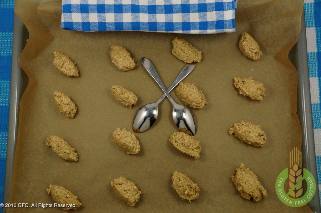 Use two teaspoons to make small dough dumplings and set on parchment paper (gluten-free oatmeal cookies).